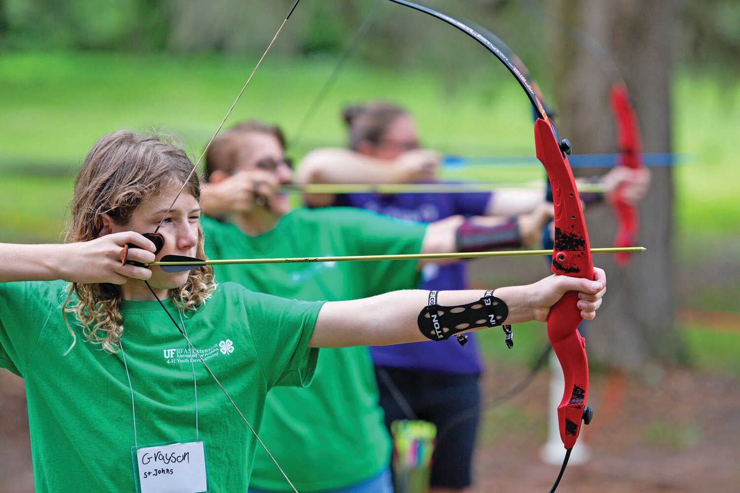 4-H youth participate in archery at 4-H Camp Cherry Lake.